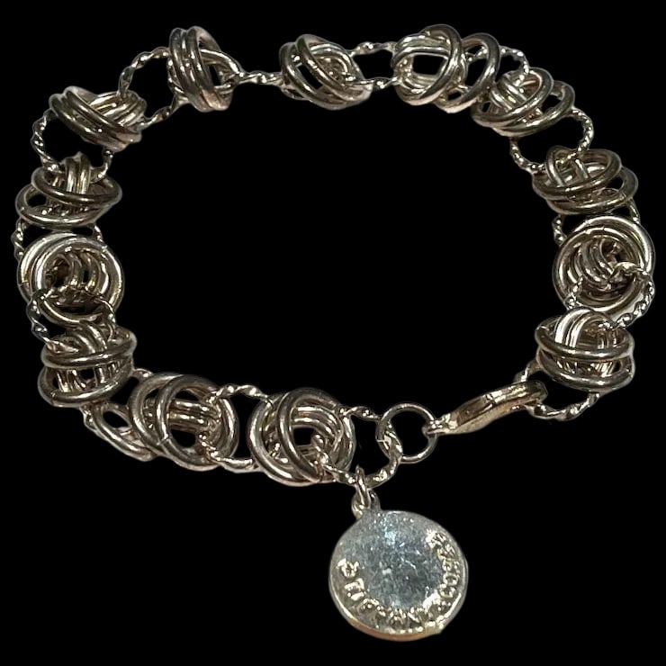 Sterling Silver Circle Charm Bracelet: Sterling Silver Circle Charm Bracelet Hallmarked: 925 Weighs 11.9 grams Measures 8.5 inches length Reserve: $75.00 Shipping: Domestic: Flat-rate of $6.00 to anywhere within the contiguous U.S. Interna