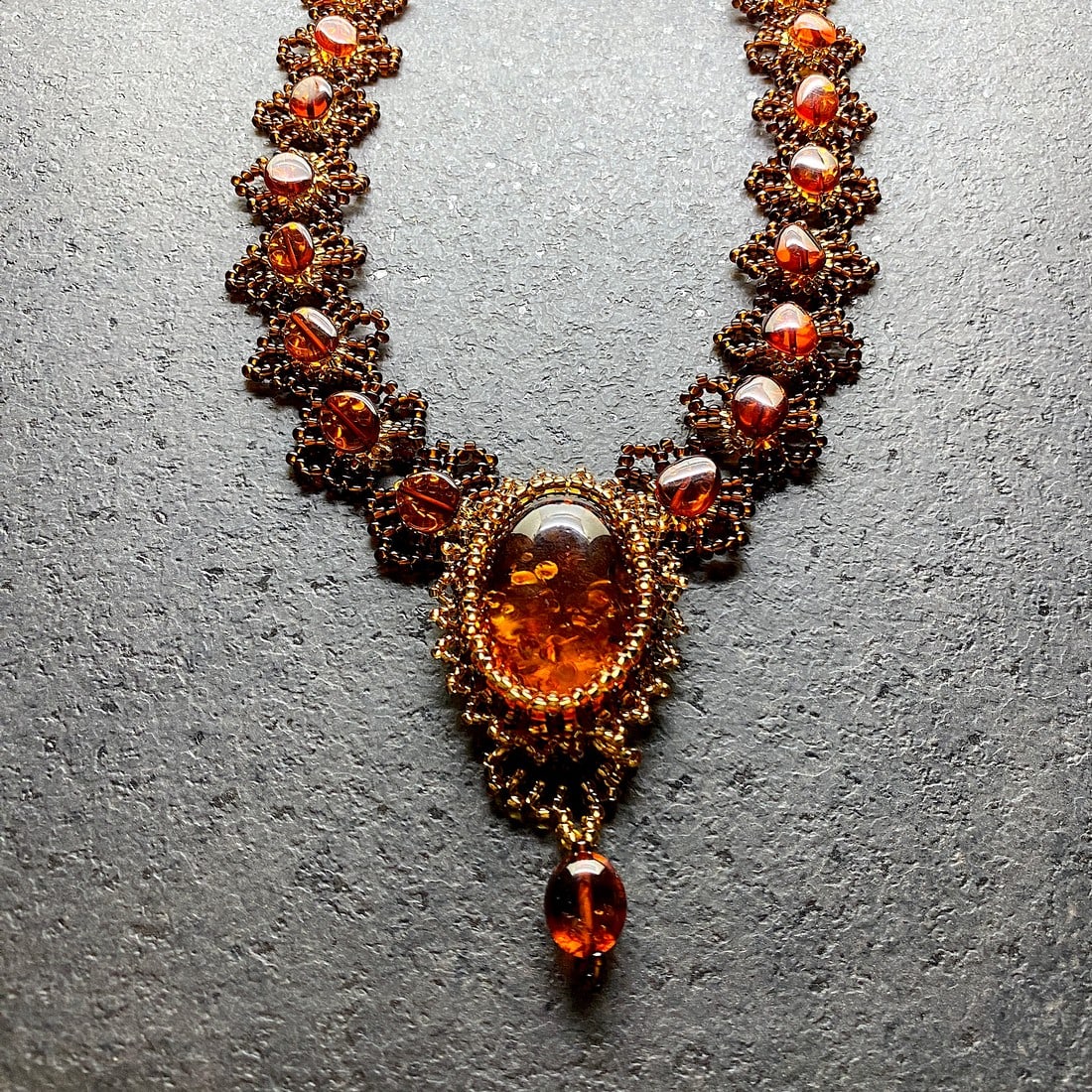 Astonishing Amber Floral Necklace made from leaf like bead ornaments: Title:Astonishing Amber Floral Necklace made from leaf like bead ornaments Metal:None Gemstone:Amber Weight:30.0 g Size:Size: 62.0 x 11.0 x 440.0 mm Size: 2.441 x 0.433 x 17.323 inches Made of:(Recons