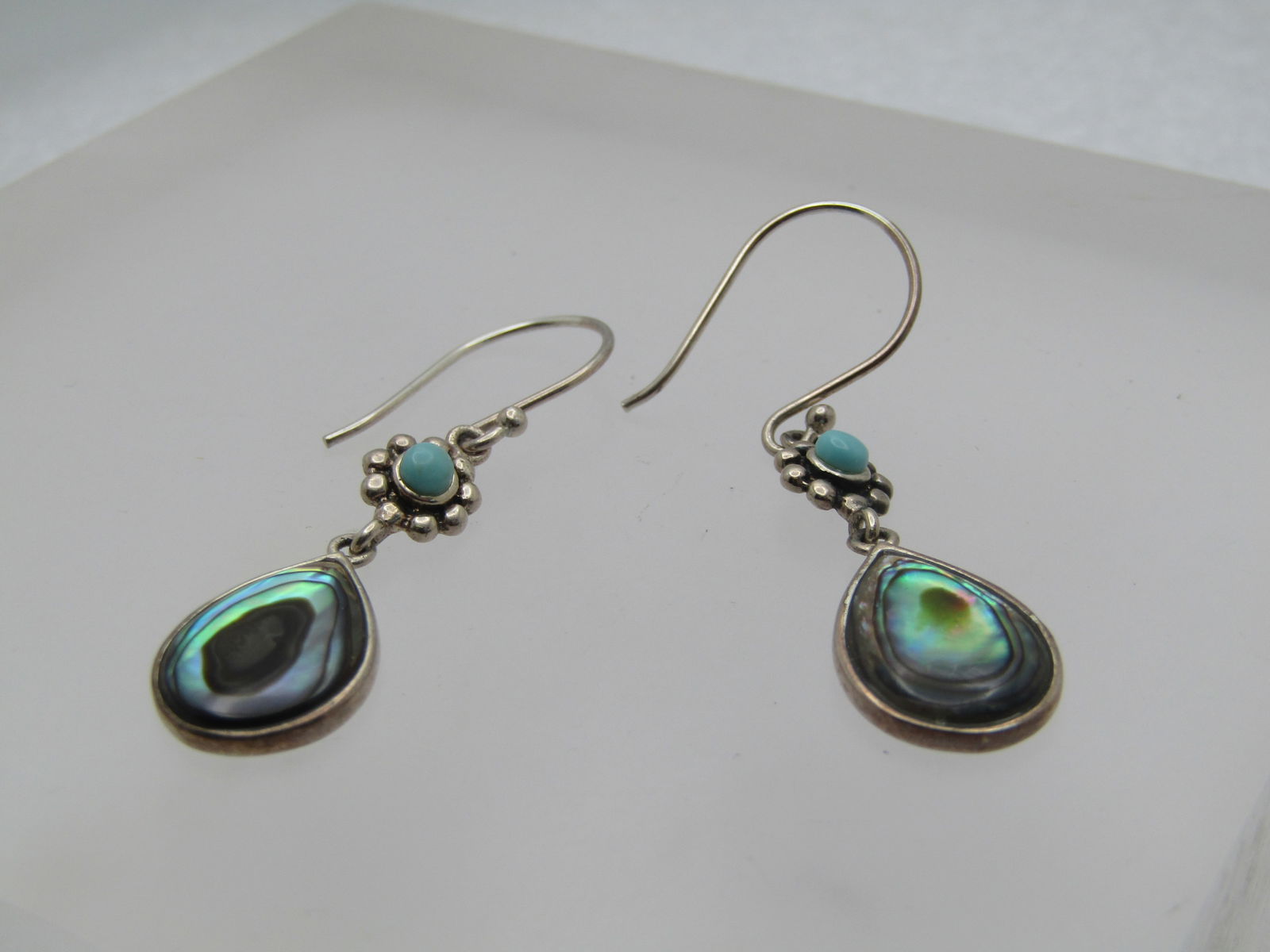 Sterling Paua/Abalone Turquoise Earrings, Pierced, 1990's, Signed: Sterling Paua/Abalone Turquoise Earrings, Pierced, 1990's, Signed CFJ Thai. These have a bezel-set paua/abalone shell drop with a blossom below the hook post with a center turquoise round stone - slee