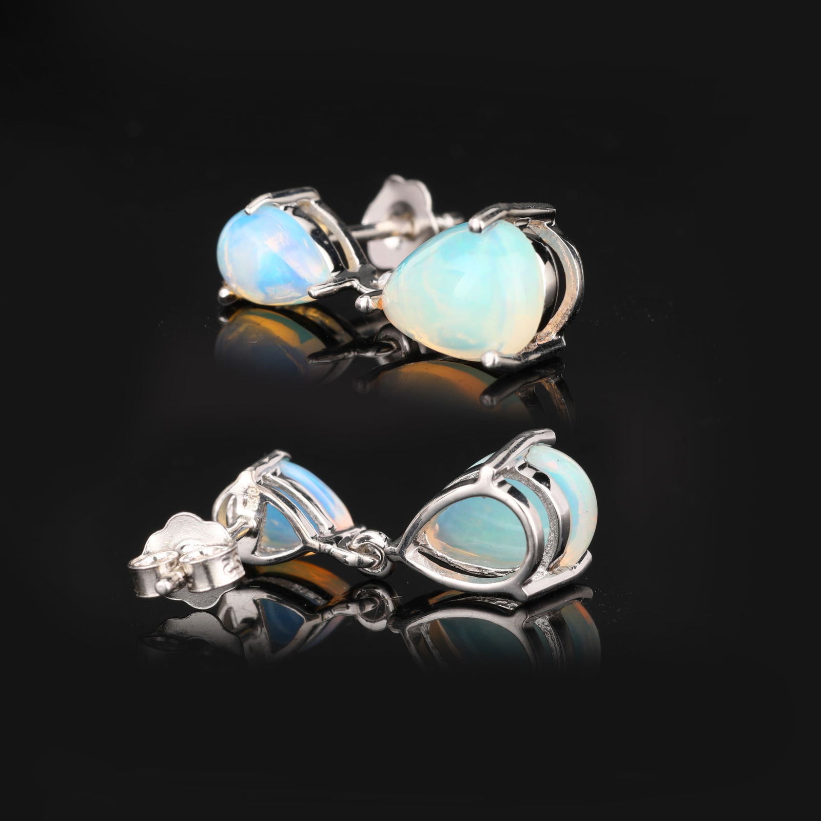 Earrings: Ethiopian Opal CAB Pear 10x7mm: Title: Earrings: Ethiopian Opal CAB Pear 10x7mm Description: Ethiopian Opal CAB Pear 10x7mm - 2Pcs + Ethiopian Opal CAB Pear 7x5mm - 2Pcs After 2000 Materials: 925 Silver W/Rhodium Weight: 2.84 Metal