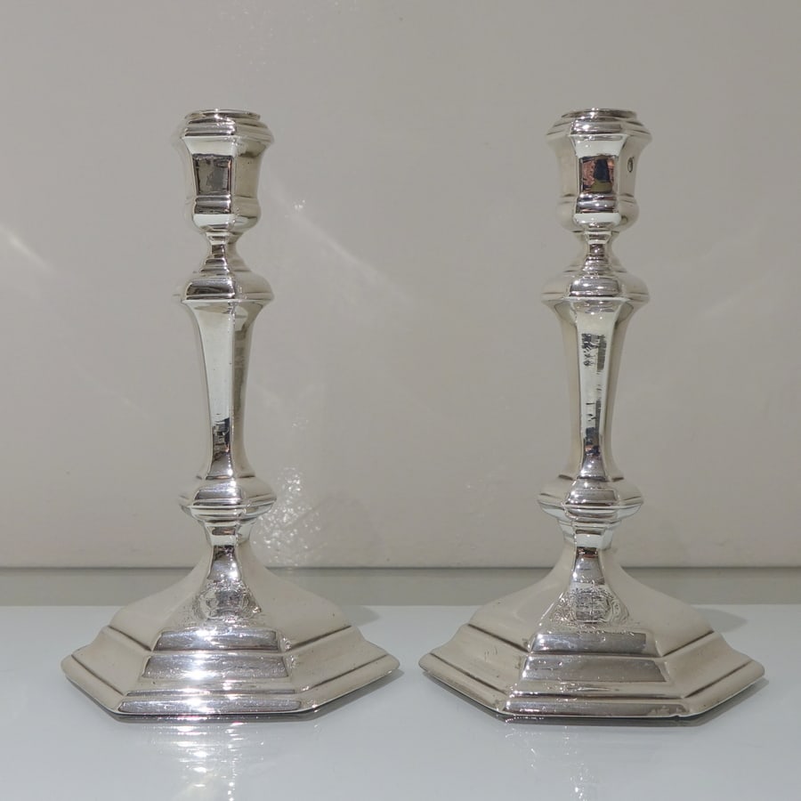 Early 18th Century Antique George I Britannia Silver Pair Hexagonal Candlesticks London 1717 Thomas: An extremely rare and highly unusual pair of tall cast hexagonal 18th century silver candlesticks with tapering stems which have been raised on a hexagonal pedestal base. Both candlesticks have stylis