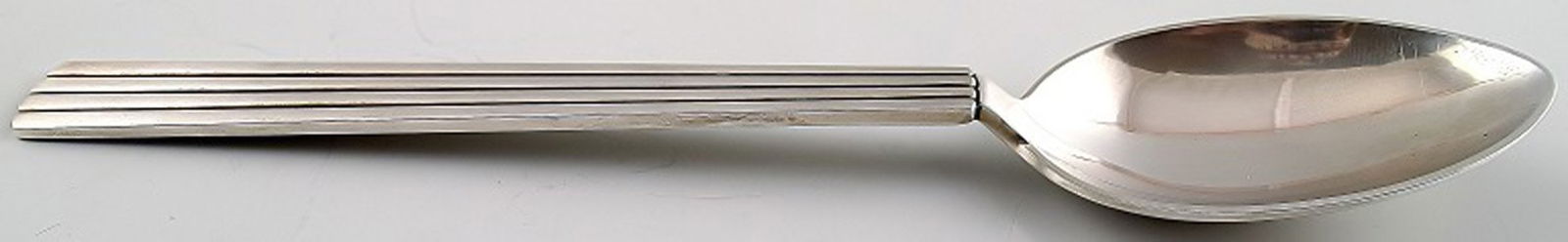 Bernadotte dessert spoons from Georg Jensen. 19 pcs. in stock.: Title:Bernadotte dessert spoons from Georg Jensen. 19 pcs. in stock. Description:19 Bernadotte dessert spoons from Georg Jensen. Bernadotte was designed by Sigvard Bernadotte in the year 1939. Measure