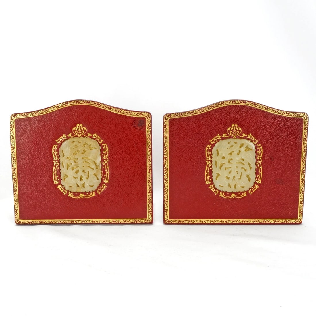 Pair Bookends Chinese Hardstone Carvings 1940's: Title:Pair Bookends Chinese Hardstone Carvings 1940's Size:4 ¾ in (12.1 cm) wide x 2 5/8 in (6.7 cm) deep x 4 ¼ in (10.8 cm) tall. Description:A pair of red gilded Florentine leather bookend