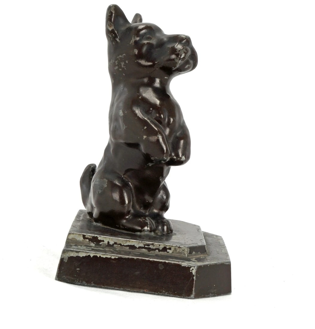 Single BRONZART Bookend Scotty Dog Begging Circa 1930: Title:Single BRONZART Bookend Scotty Dog Begging Circa 1930 Size:3 ¾ in (9.5 cm) wide x 3 1/8 in (7.9 cm) deep x 4 7/8 in (12.4 cm) tall. Description:A fun bookend in the shape of a upright beggi