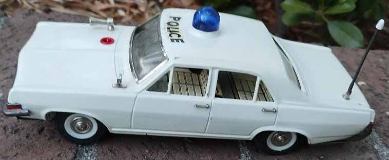 Schuco (Made in US Zone Germany) Alarm Police car 5349,the dome light flashes, the car produces a: Title: Schuco (Made in US Zone Germany) Alarm Police car 5349,the dome light flashes, the car produces a shrieking alarm sounds, the rear wheels move,c8. Description: Schuco (Made in US Zone Germany)