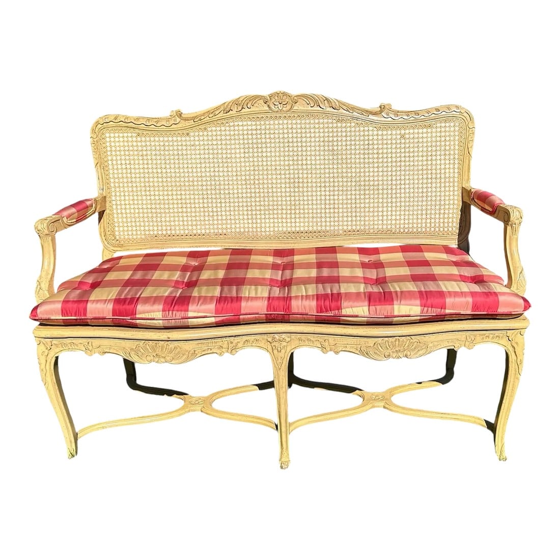 Vintage Cane Bench: Gorgeous French provincial caned settee. It has upholstered arms and seat cushion in pink and cream silk check fabric. It came out of an estate in Greenspring Valley, MD. It's in near perfect conditio