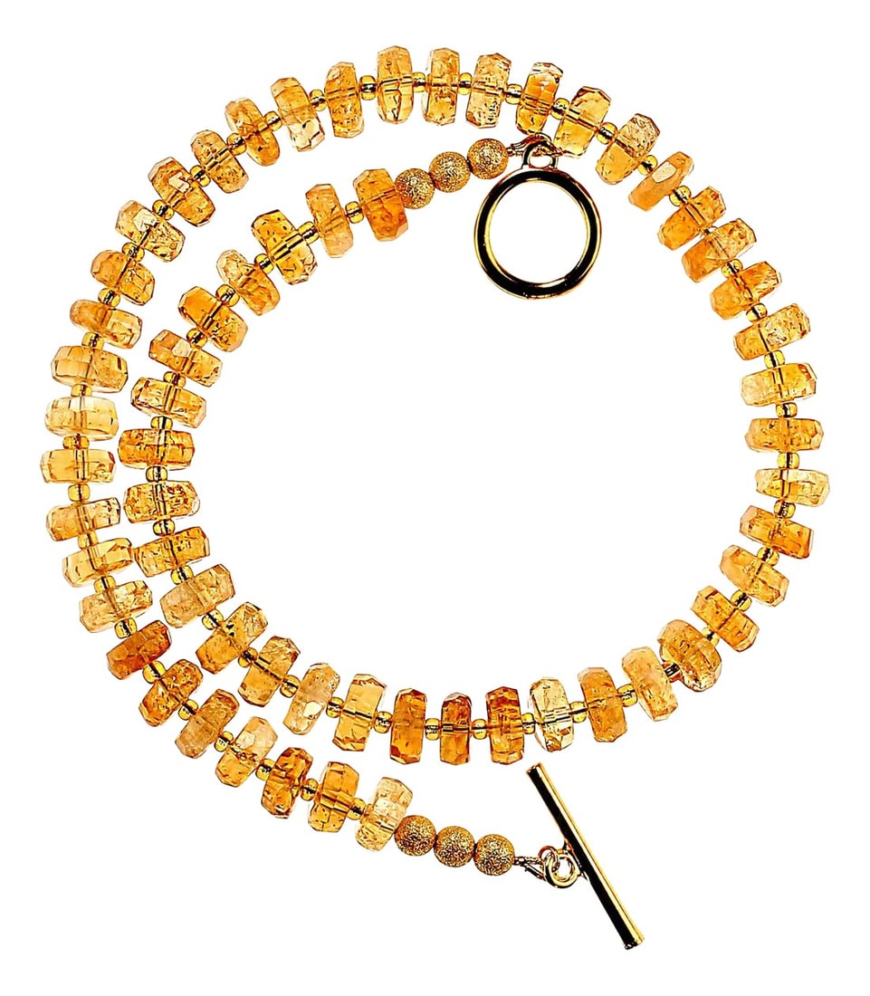 Sparkling Golden 18-Inch Citrine Necklace: 18-Inch Sparkling Citrine Necklace Genuine Citrine Gemstones: Features 10mm faceted rondelle citrines, expertly cut to maximize their brilliance and light reflection. Elegant & Versatile: With an 18-i