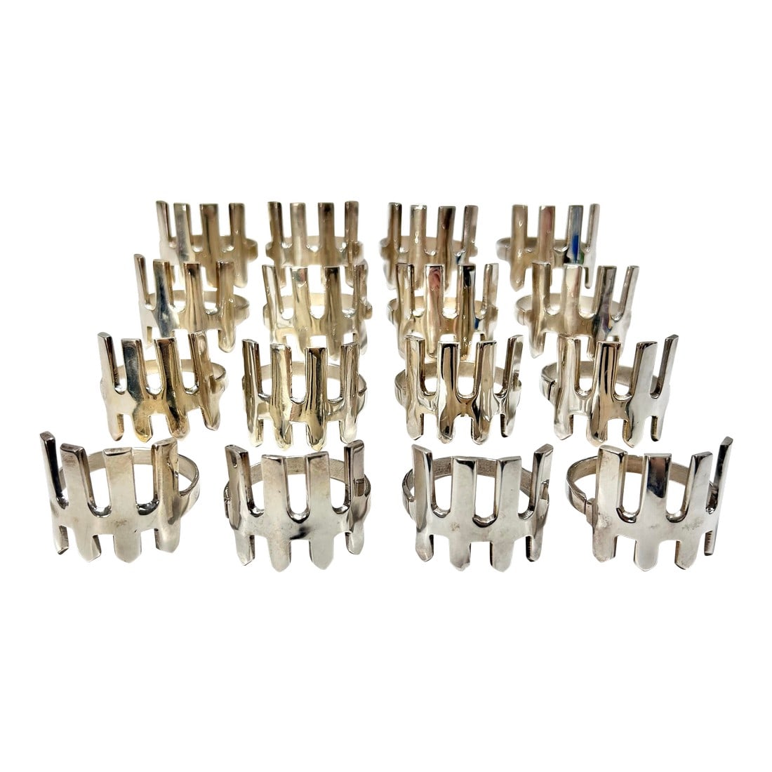 1980s Silver Plated Brutalist Napkin Rings - A Set of 16: A large, hard-to-find, silver plated, matching set of 16. They easily stack within each other for easy storage. They were purchased from a high-end estate. Dimensions 1.75"" wide/deep 1.5"" tall Condi