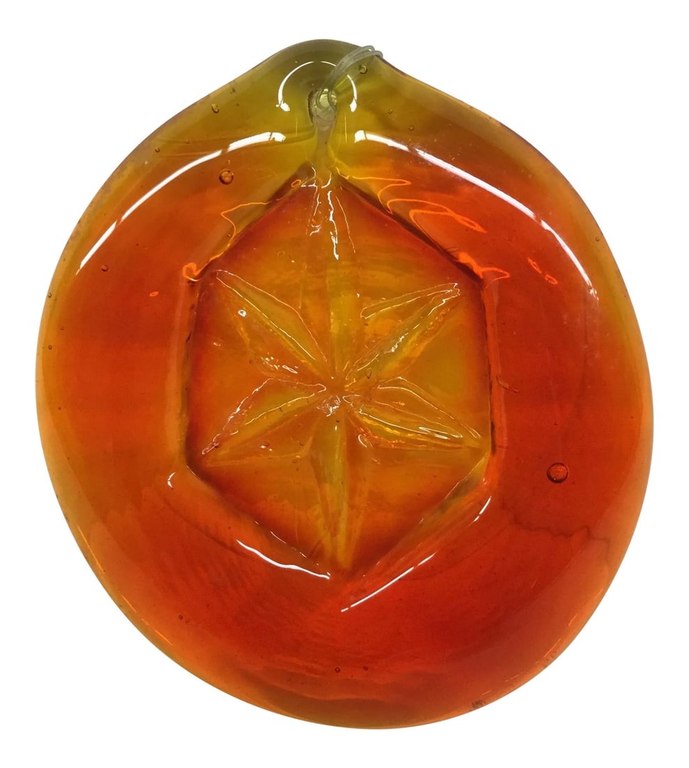 Vintage Hand Blown Orange Glass Ornament: Heavy glass ornament which could be hung anywhere to light up the room with bright colors. It has a nylon fishing wire attached but can be changed to anything you like. Try it in a widow with direct s
