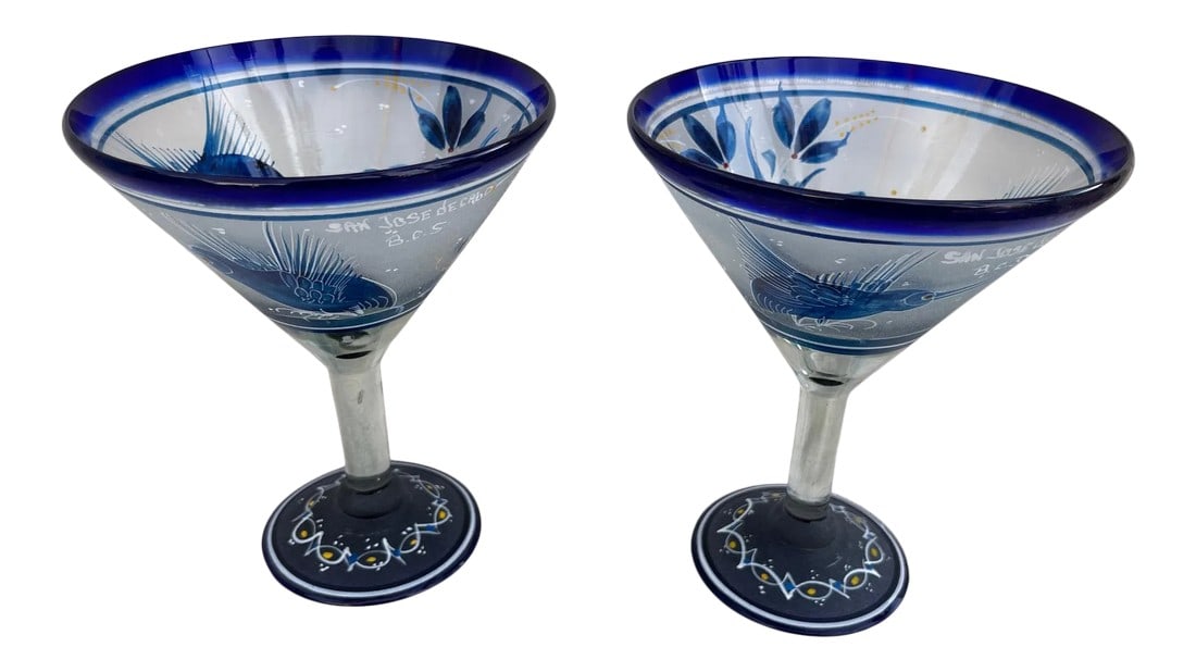 El Palomar Hand Painted Hummingbird Print Margarita Glasses - Set of 2: Beautiful set of 2 Blue Hand Painted Hummingbird Margirita Glasses Thick glass that have been hand painted throughout. San Jose Decabo B.C.S printed on side 7in h x 5.75in center Condition: Alteration