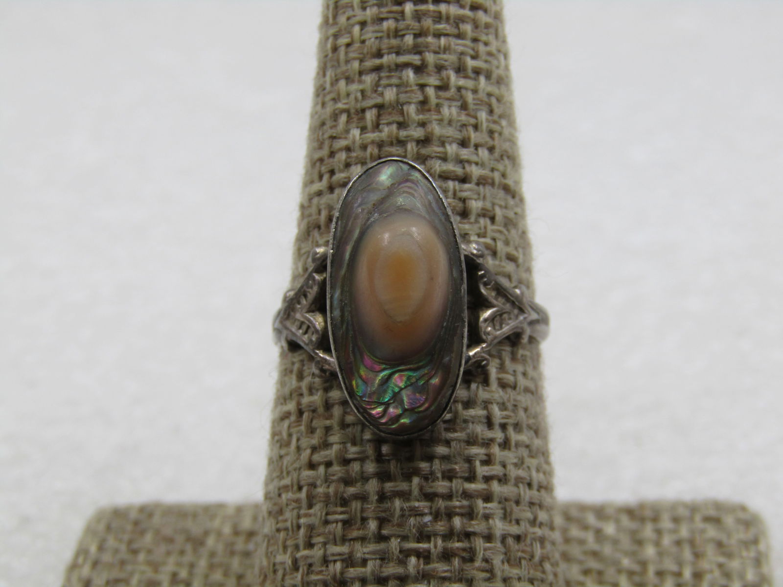 Vintage Sterling Blister Pearl Ring, Abalone, Sz. 8, 1930's-1940's: Vintage Sterling Blister Pearl Ring, Abalone, Sz. 8, 1930's-1940's. The pearl is appx. 18.5mm long and 9 mm wide. Bezel-set. It has a pink blister on top. The top shoulders of the band have an ornate