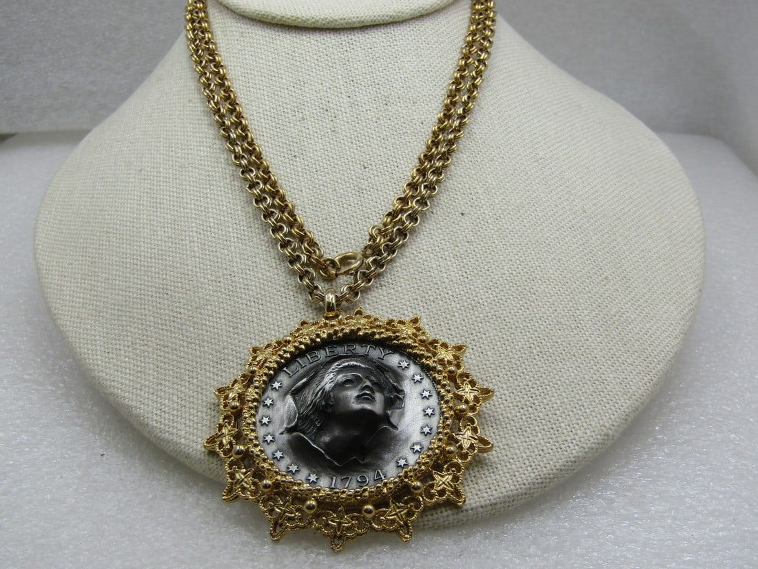 Vintage Faux Raised 1794 Liberty Coin Necklace, 30" Chain, Two-Tone, 1960's-1970's: Vintage Faux Raised 1794 Liberty Coin Necklace, 30" Chain, Two-Tone, 1960's-1970's. The pendant is framed with a filigree frame and textured frame. Gold tone with the pewter tone raised faux 1794 Libe