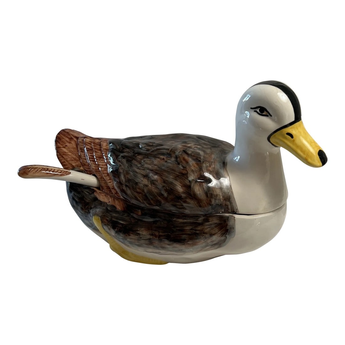 Mid Century Majolica Duck Tureen With Ladle: A splendid majolica soup tureen in the shape of a duck. He is painted in browns and white with a touch of yellow. The ladle also has a touch of brown. I just love his yellow feet! Made in Portugal. Co