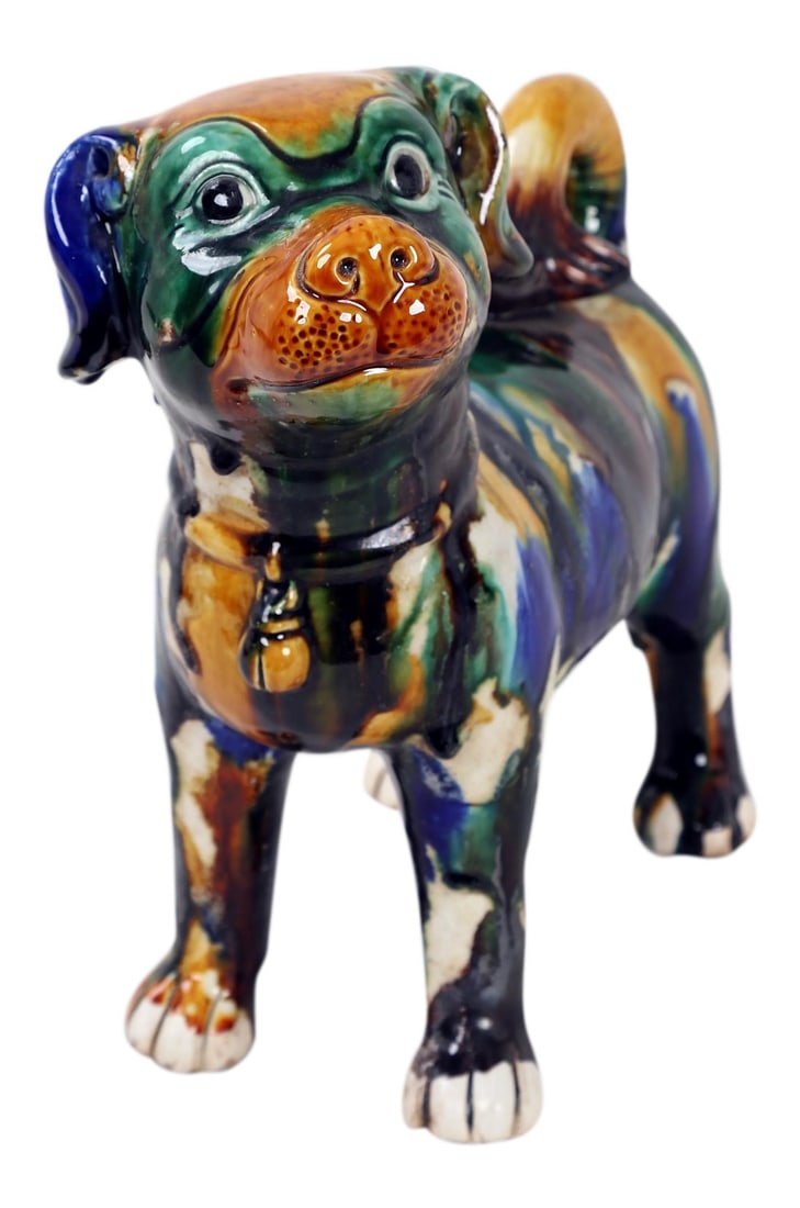 Early 20th Century Antique Multi-Colored Fu Dog Sculpture: This multi colored pup is glazed in green, yellow, blue and brown. Giving it a cheerful disposition, as if it were a troublemaker. Makes a great pair with 1970s Vintage Multi-Colored Fu Dog Sculpture 