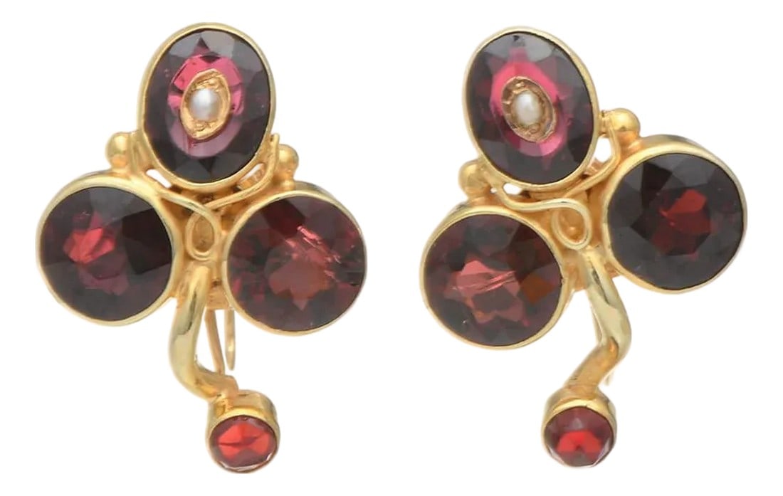14KY Vintage Garnet(7.28) Floral Earrings, 2 pieces: Dark red garnets give these yellow gold earrings a mysterious flair. Few vintage jewels embrace the floral design with such beauty and elegance. These earrings will become the center point of your jew