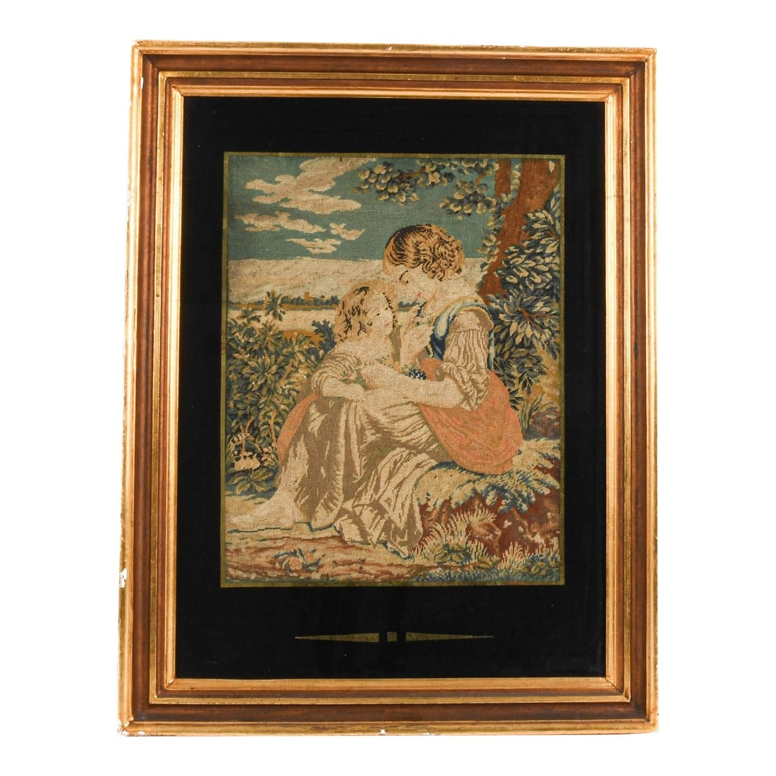 Antique Framed French Aubusson Woven Mother and Child Tapestry: This Antique Framed French Aubusson Woven Mother and Child Tapestry is a delicate piece capturing an intimate moment between a pair in a serene outdoor setting. Rendered in soft, muted earth tones typ