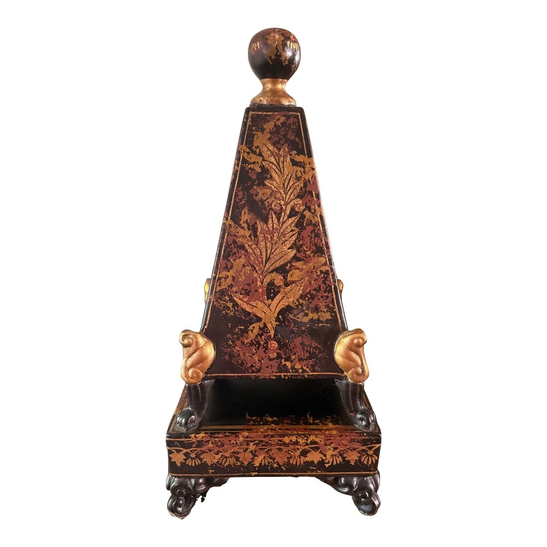 Chinoiserie Style Obelisk: Beautiful Obelisk in the Chinoiserie style. Black, brown and gilt gold accents make this piece a show stopper. Standing almost 19" tall and made of a ceramic material this is a heavy item. Condition: