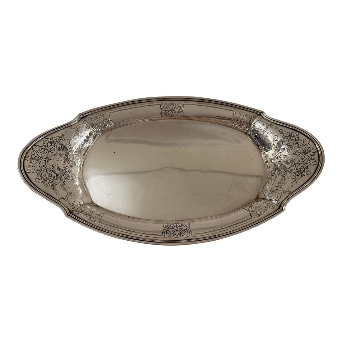 Antique Tiffany & Co. Sterling Silver Oval Dish With Ornate Floral Handle: Antique Tiffany & Co. sterling silver oval dish featuring an elaborate, ornate floral and nature-inspired design etched along the side handle. A refined and decorative piece with strong display and se