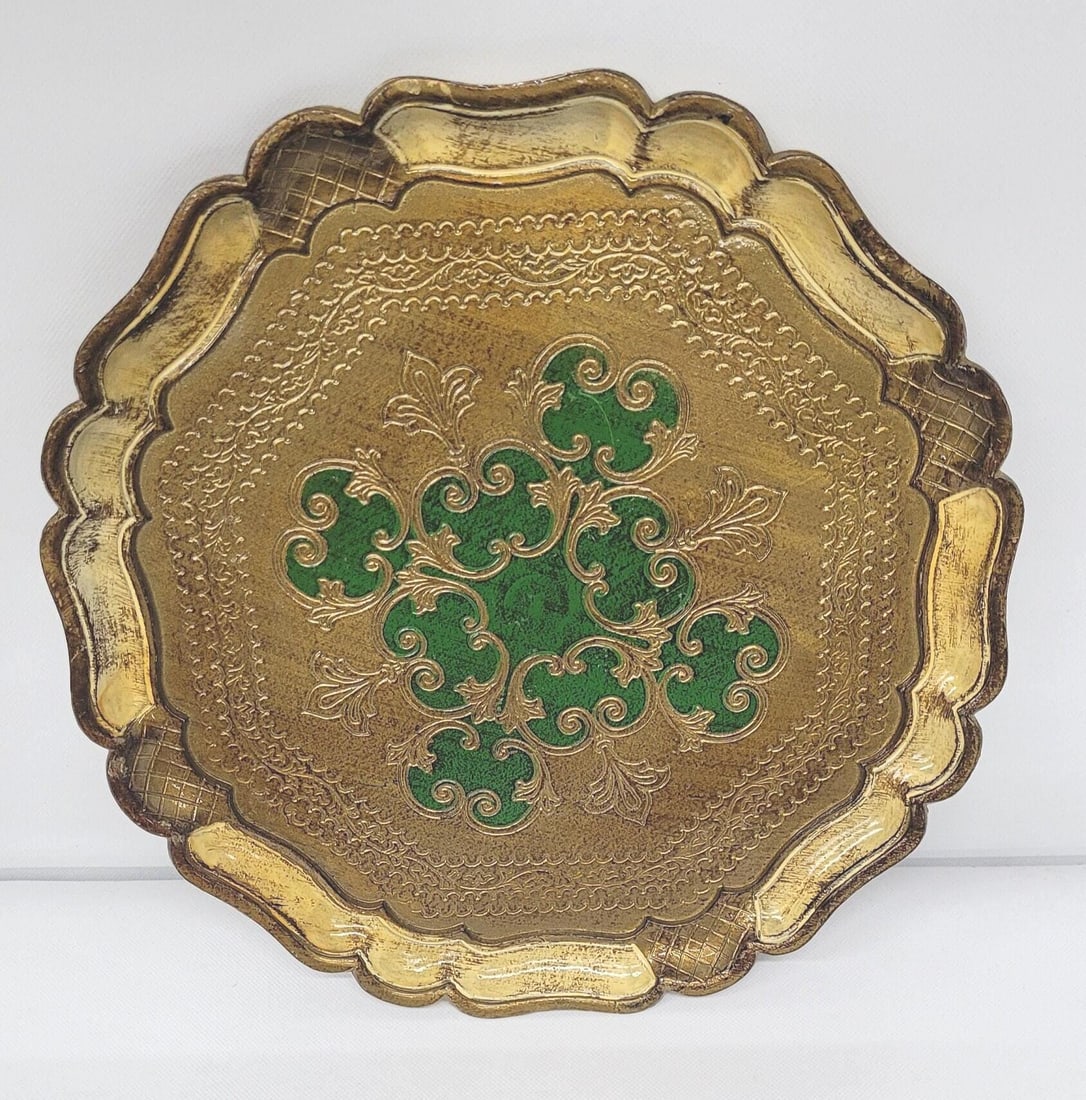 Vintage Italian Round Tray Green & Gold for Vanity or Bar cart, stamped Made in Italy, 13": Vintage from the 1960s Materials: plastic Width: 13 inches Height: .5 inches Length: 13 inches Vintage Italian Round Tray Florentine-style round tray in molded plastic with a green and gold finish, st