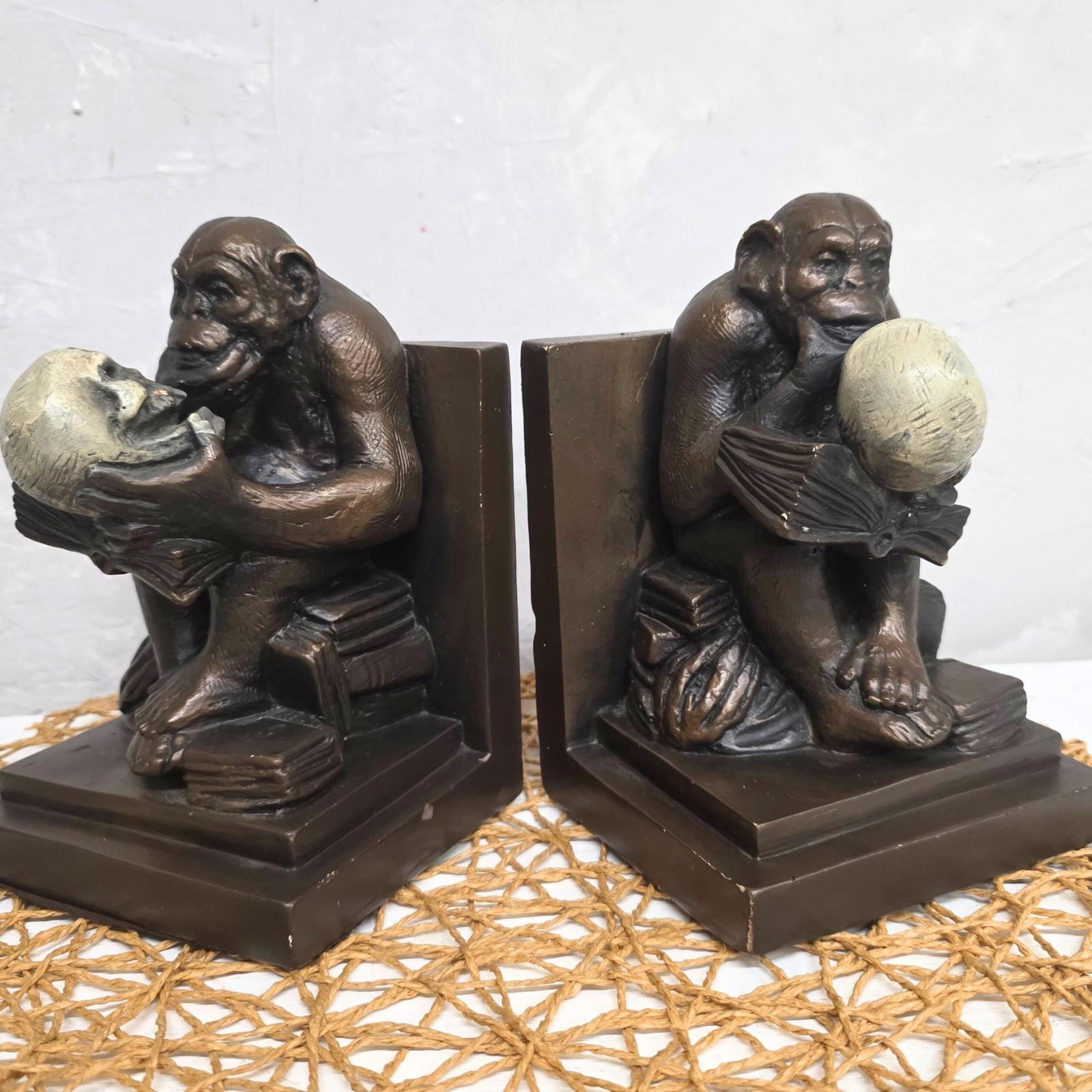 Vintage Castlecore Monkey Bookends Mid Century Chalkware Evolution Sculpture Pair Philosophical: Vintage from the 1980s Materials: Medium: Clay, Plaster Width: 5 inches Height: 7.5 inches Depth: 4.5 inches These vintage chalkware bookends reinterpret the iconic Darwin Monkey in thoughtful mid-cen