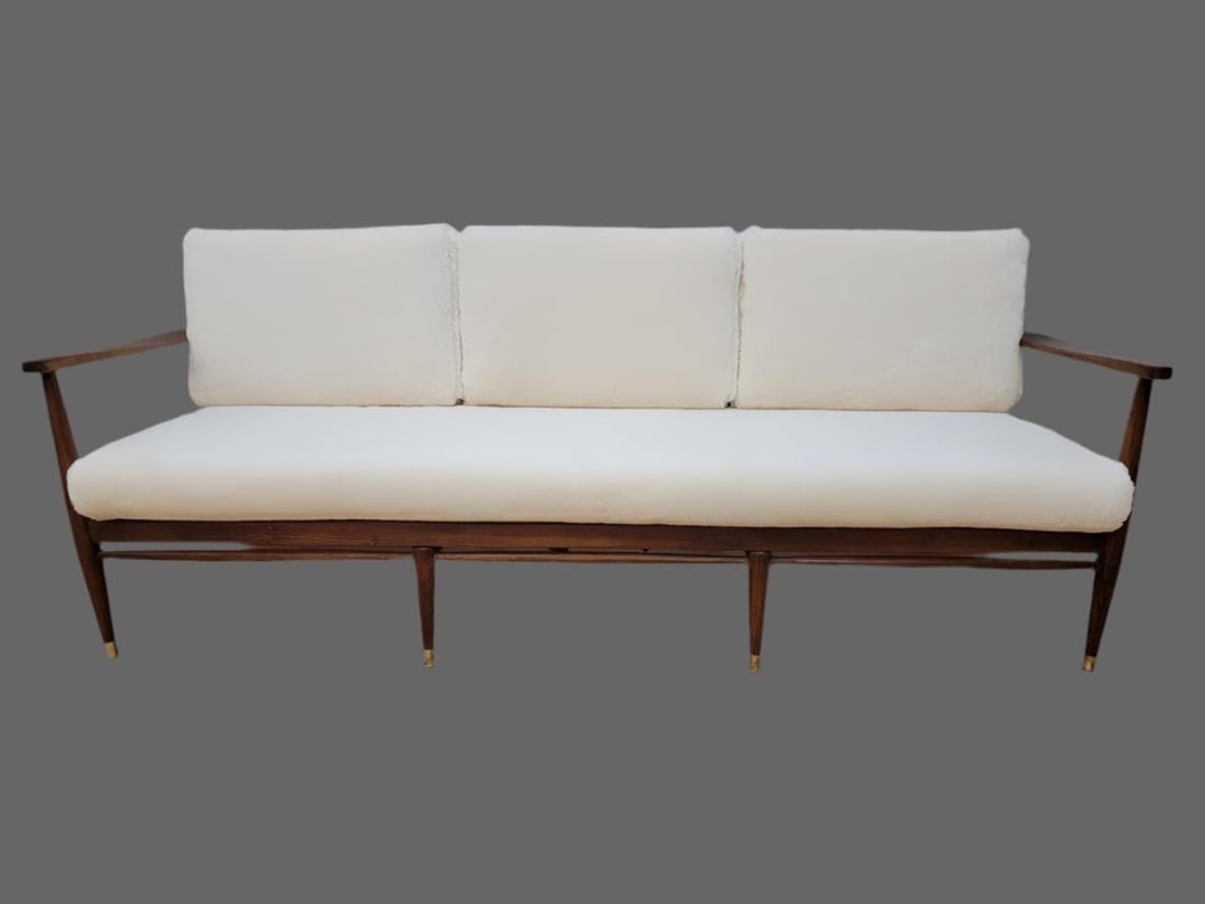 Danish Modern Walnut Sofa by Ib Kofod-Larsen Newly Reupholstered in Ivory Shearling: Danish Modern Walnut Frame Sofa Newly Reupholstered in Ivory Sheep's Wool Shearling by Ib Kofod-Larsen Elegant Danish modern sofa designed by architect and furniture designer Ib Kofod Larsen for Selig