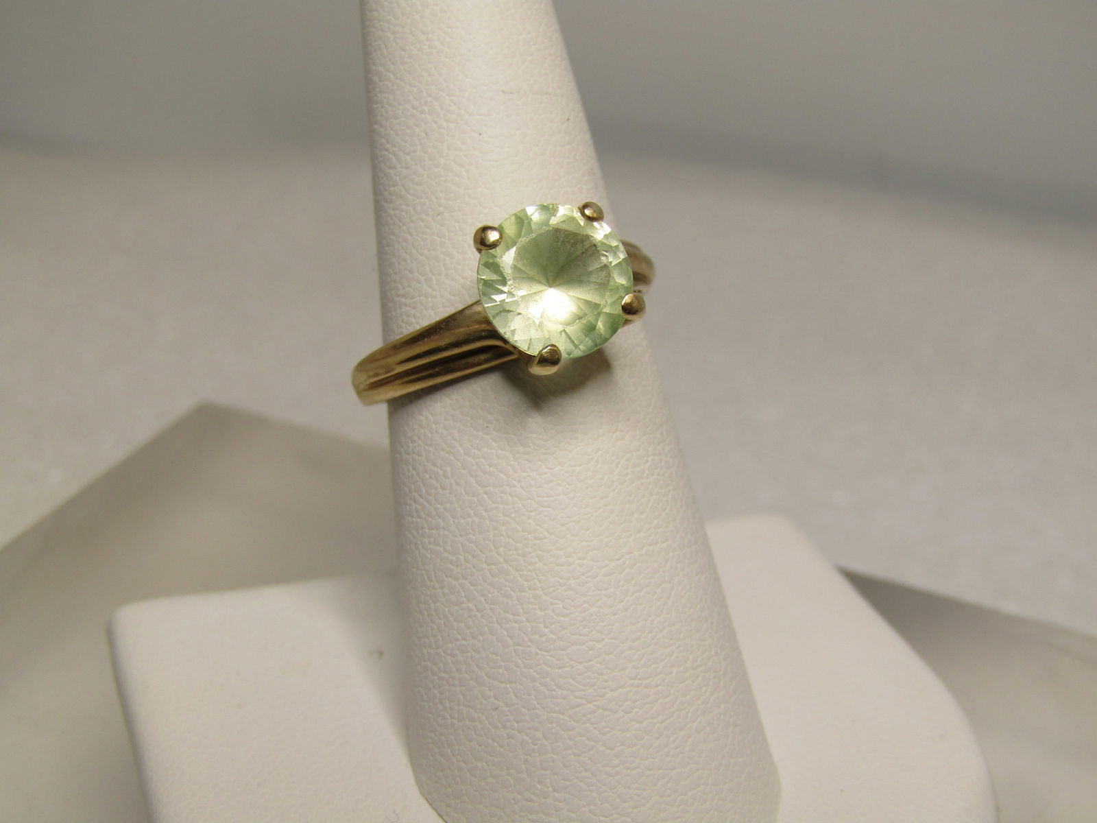 Vintage 10kt Spinal Solitaire Ring, Sz. 7.5, Signed KIM, 1970's-1980's: Title:Vintage 10kt Spinal Solitaire Ring, Sz. 7.5, Signed KIM, 1970's-1980's Description:Vintage 10kt Spinal Solitaire Ring, Sz. 7.5, Signed KIM, 1970's-1980's. The stone tests as spinel and under UV