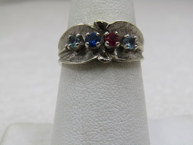 Vintage 14kt White Gold Mother's Ring, Sz. 7, 5: Description:Vintage 14kt White Gold Mother's Ring, Sz. 7, 5. It has two ight blue topaz, a ruby, and a dark blue spinel sapphire. The birth months are believed to be December, July, and September. Eac