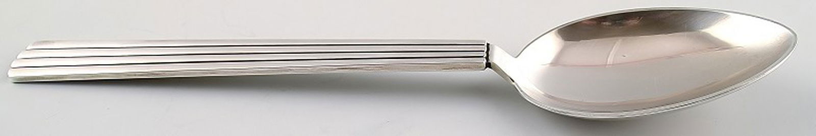 Bernadotte spoon Georg Jensen. 14 pcs. in stock.: Title:Bernadotte spoon Georg Jensen. 14 pcs. in stock. Description:14 Bernadotte spoon Georg Jensen. Bernadotte was designed by Sigvard Bernadotte in 1939. Measures 20 cm. Marked. Reserve: $84.00 Ship