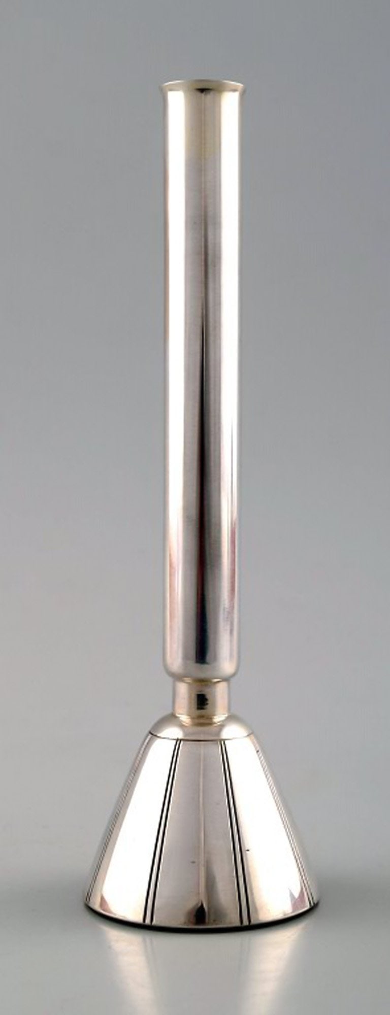 Modernist candlestick / vase of silver, C G Hallberg, Sweden.: Title:Modernist candlestick / vase of silver, C G Hallberg, Sweden. Description:Modernist candlestick / vase of silver, C G Hallberg, Sweden. Height 18.5 cm. X 7 cm. Stamped. C. GH. H9 = in year 1958.