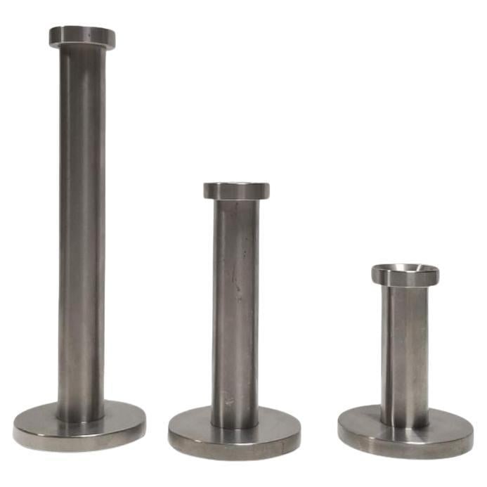 Danish Mid-Century Stainless Steel Candlestick Holders set of 3: Title: Danish Mid-Century Stainless Steel Candlestick Holders set of 3 Description: Introduce a touch of mid-century modern charm to your decor with this set of three Mid-Century Stainless Steal Candl