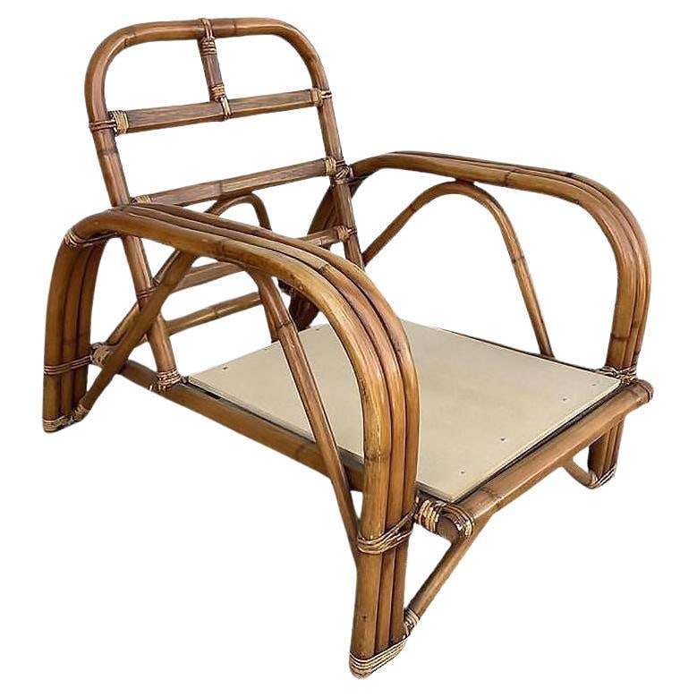 Restored Rattan Dark Stained Three-Strand "Staple" Arm Lounge Chair: Title: Restored Rattan Dark Stained Three-Strand "Staple" Arm Lounge Chair Description: Restored original 1948 Paul Laszlo-designed two-strand "Staple Arm" lounge chair finished with a dark chestnut s