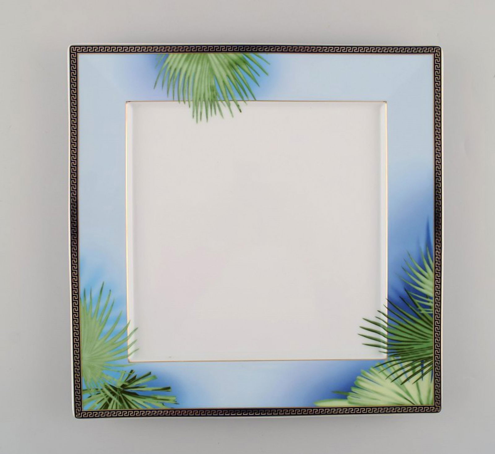 Gianni Versace for Rosenthal. Large "Jungle" porcelain cover plate / dish with gold decoration and: Gianni Versace for Rosenthal. Large "Jungle" porcelain cover plate / dish with gold decoration and green leaves. Late 20th century. In perfect condition. Measures: 38 x 2.8 cm. Stamped. Reserve: $210.