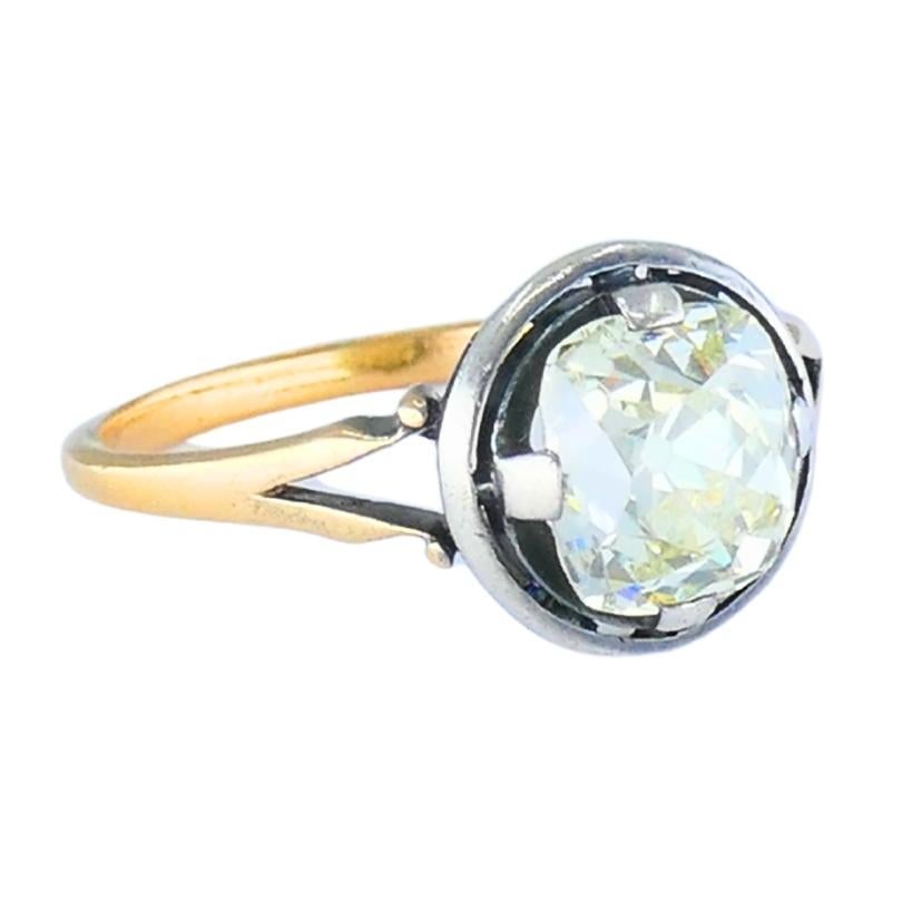 Victorian Engagement Ring 14k Gold Silver Old Mine Cut Diamond: Title: Victorian Engagement Ring 14k Gold Silver Old Mine Cut Diamond Description: A Victorian-era engagement ring featuring a remarkable 1.75-carat old mine cut diamond. The cushion-shaped gemstone d