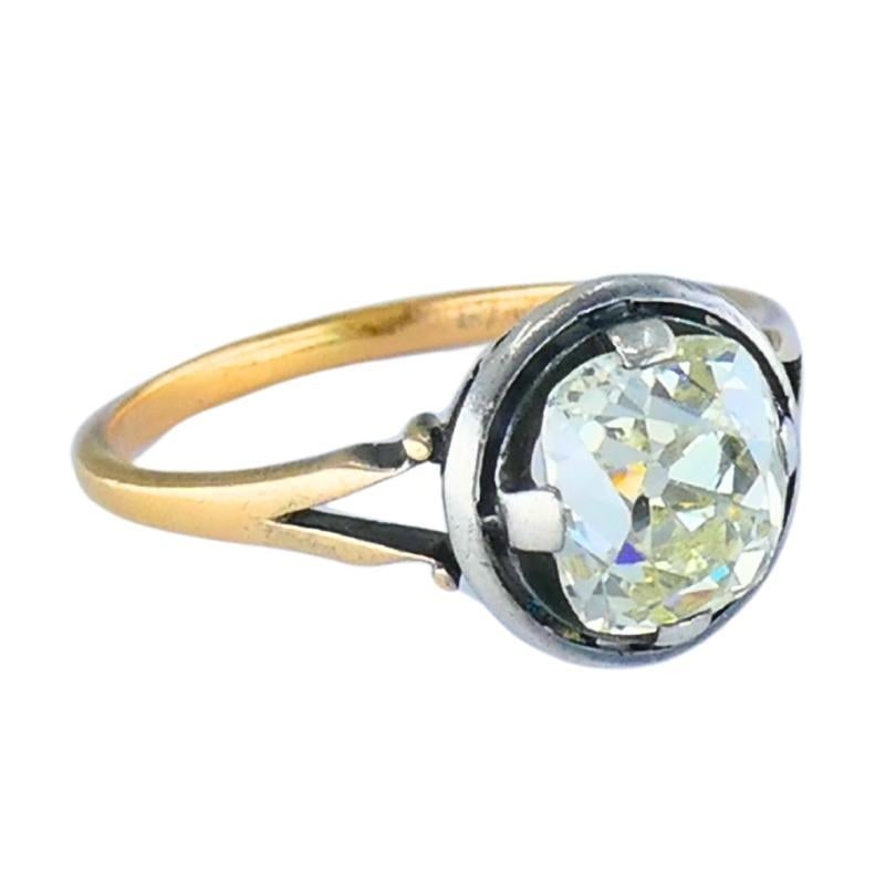Victorian Engagement Ring 14k Gold Silver Old Mine Cut Diamond: Title: Victorian Engagement Ring 14k Gold Silver Old Mine Cut Diamond Description: A Victorian-era engagement ring featuring a remarkable 1.75-carat old mine cut diamond. The cushion-shaped gemstone d