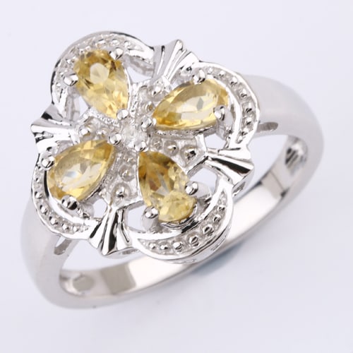 Ring: Citrine Pears 5x3mm: Title: Ring: Citrine Pears 5x3mm Description: Citrine Pears 5x3mm - 4Pcs + White Topaz Round 1.50mm - 1Pcs Date/Period: After 2000 Materials: 925 Silver W/Rhodium Gross Weight: 3.38 Gem Weight: 0.9 Di