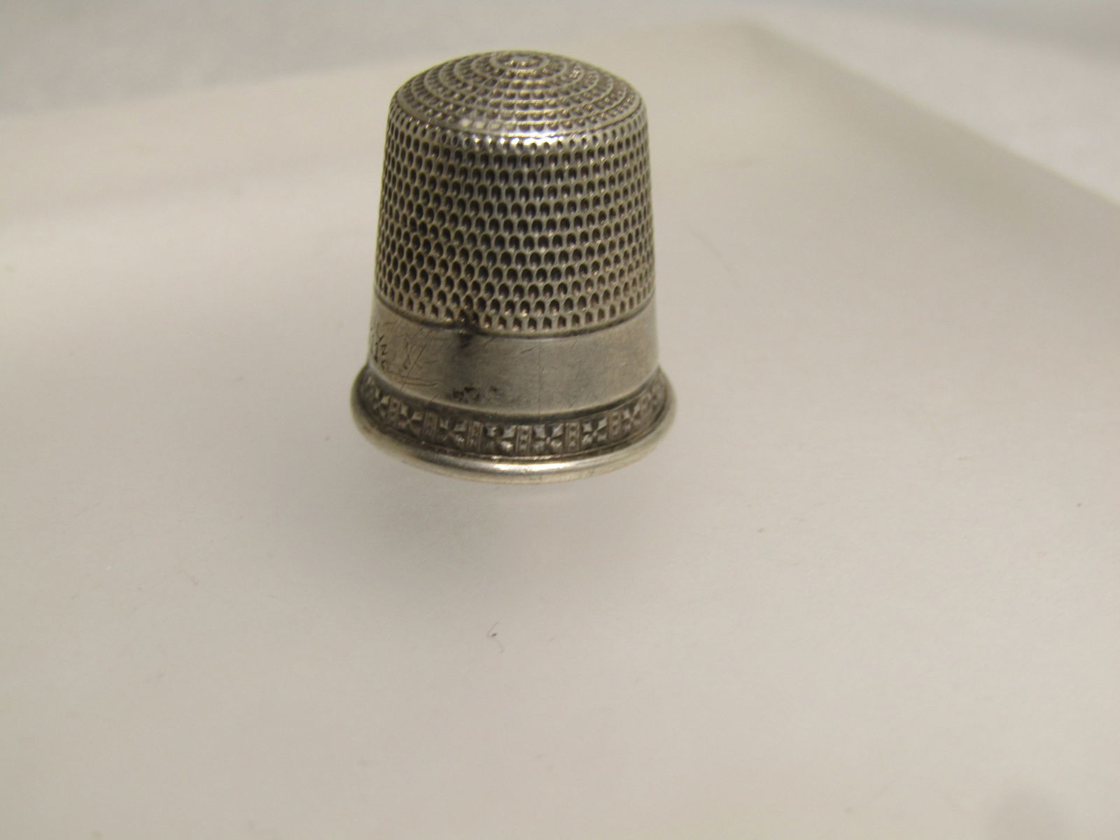 Vintage to Antique Sterling Silver Thimble, Sz. 11, Signed, Victorian to 1920's: Vintage to Antique Sterling Silver Thimble, Sz. 11, Signed, Victorian to 1920's. This is signed with a shield shape and an S crossing inside it on the inside top of the thimble. It is marked sterling