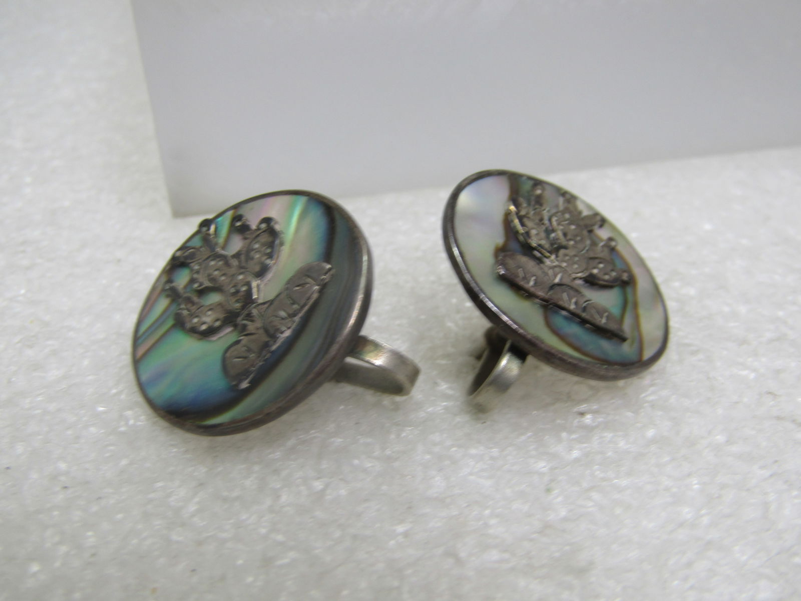 Vintage Sterling Mexican Abalone Cactus Earrings, Screwback, 1950's-1960's: Vintage Sterling Mexican Abalone Cactus Earrings, Screwback, 1950's-1960's. These have abalone inlaid in a round setting with a cactus in sterling over top. The earrings are appx. 7/8" across. They ar