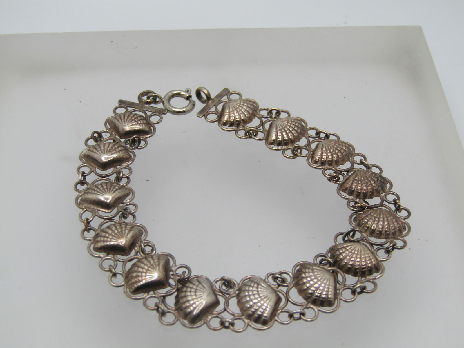 Vintage Sterling Seashell Filigree Bracelet, 7.5", 1940's-1950's: Vintage Sterling Seashell Filigree Bracelet, 7.5", 1940's-1950's. This has shells set on filigree links. The bracelet is appx. 11mm wide and 7.5" wide. The spring clasp is newer than the bracelet. It