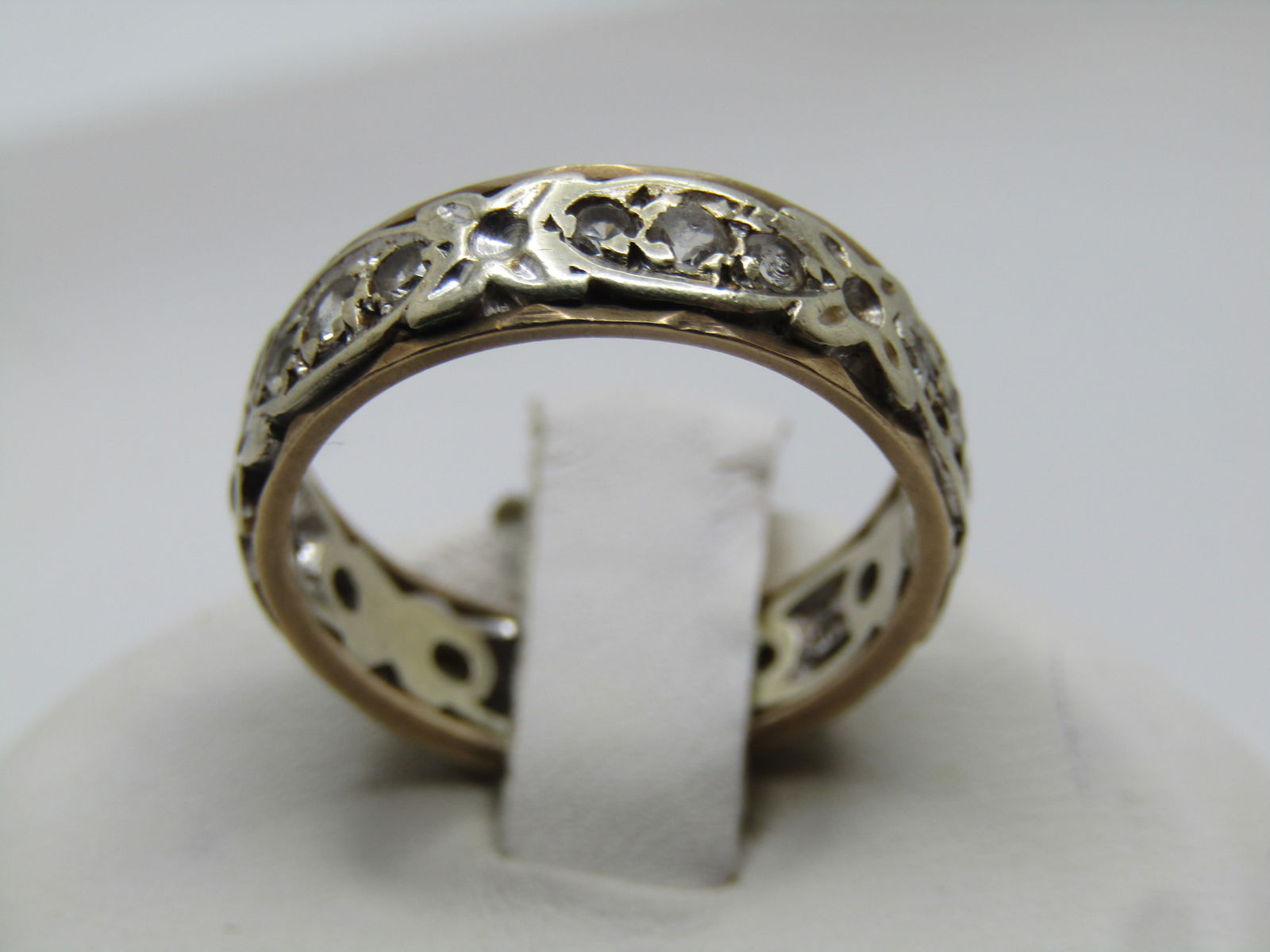 Antique 9kt Wedding Band, Two-Tone, White Topaz, Sz. 6, Signed. 1800's-1915: Antique 9kt Wedding Band, Two-Tone, White Topaz, Sz. 6, Signed. 1800's-1915. This is 9kt yellow gold inside and behind the white gold in the center with a scrolled design with clear stones that test a