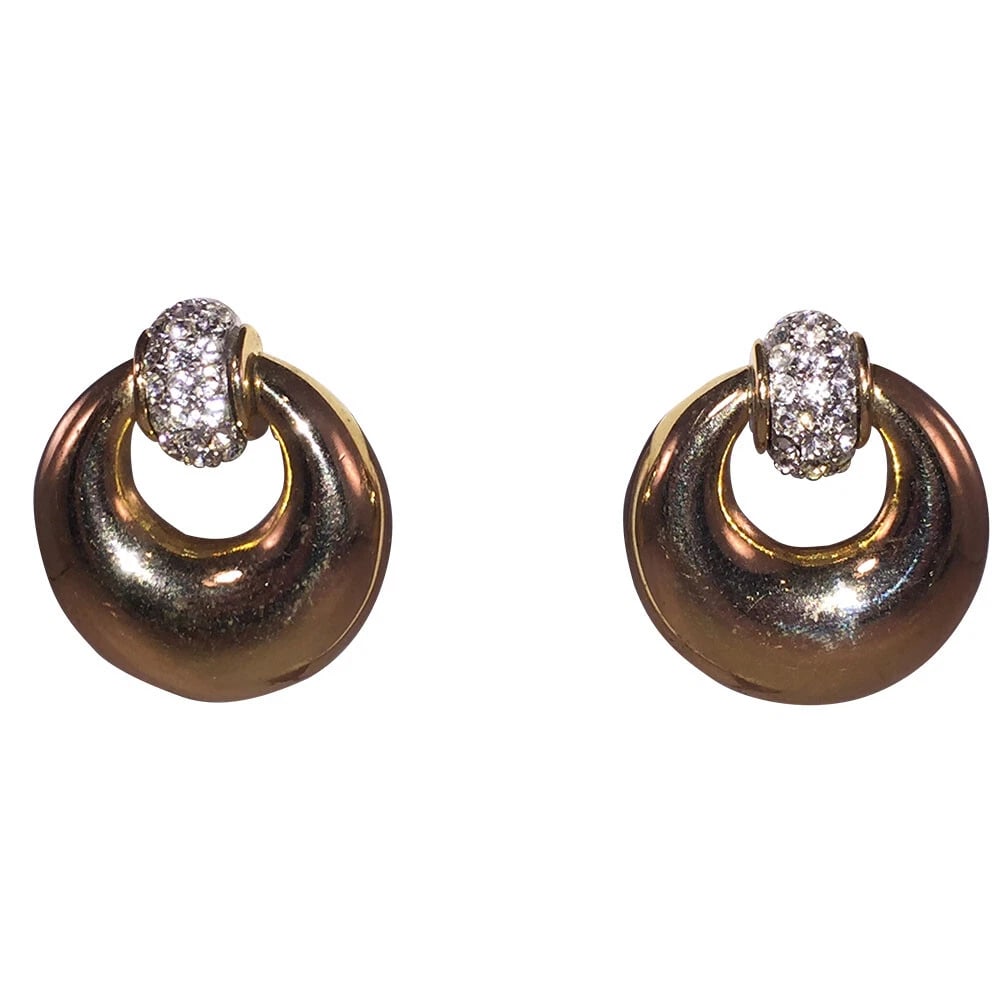 Givenchy Rhinestone Dangle Hoop Earrings: Title:Givenchy Rhinestone Dangle Hoop Earrings Description:Givenchy Rhinestone Dangle Hoop Earrings, 18 kt gold plated over costume metal. Circa 1970's Earrings measure 1 1/2" long by 1 1/4" wide. Pie