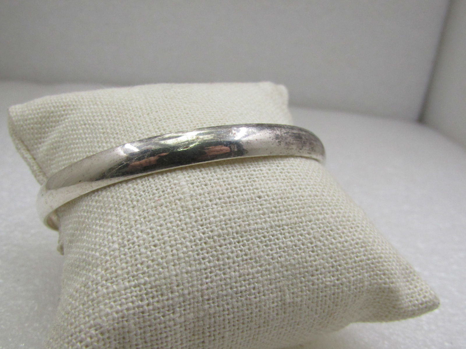 Vintage Silver Bangle Bracelet, 8.25", 6.5mm: Vintage Silver Bangle Bracelet, 8.25", 6.5mm. Domed bangle bracelet. It is not marked or signed. Tests as silver and has an anti-tarnish treatment with high gloss. No magnetic reaction with rare earth