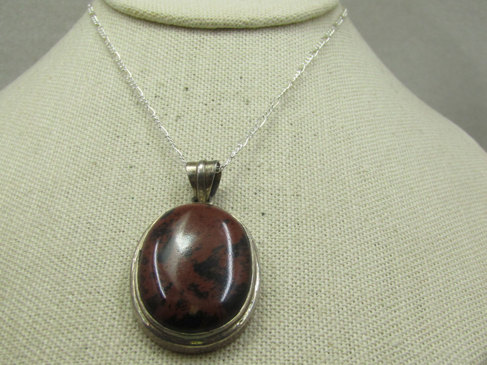 Vintage Sterling Brown & Black Jasper Pendant with 20" Figaro Chain: Vintage Sterling Brown & Black Jasper Pendant with 20"Figaro Chain. The pendant is marked .925 and has been tested and is sterling. The pendant's weight is appx. 16.45 gr., including the stone. The ch