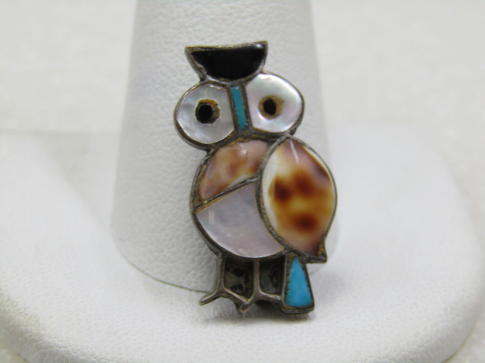Vintage Sterling Southestern Inlaid Owl Pendant Brooch: Vintage Sterling Southwestern Inlaid Owl Pendant Brooch, 1" tall inlaid with shell, mother-of-pearl, onyx, turquoise. Pendant and brooch,apx. 5/8" wide. It is not signed or marked. Weight is appx. 2.0