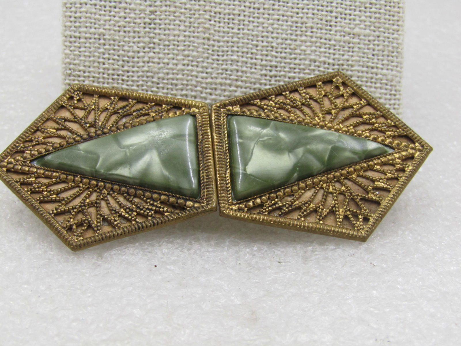 Vintage Czechoslovakia Faux Pearl Buckles. It is 3" long and 1.25" wide: Vintage Czechoslovakia Faux Pearl Buckels. It is 3" long and 1.25" wide with a filigree brass metal and on each buckle piece there is an elongated triangle of green pearlized insert made of plastic. T