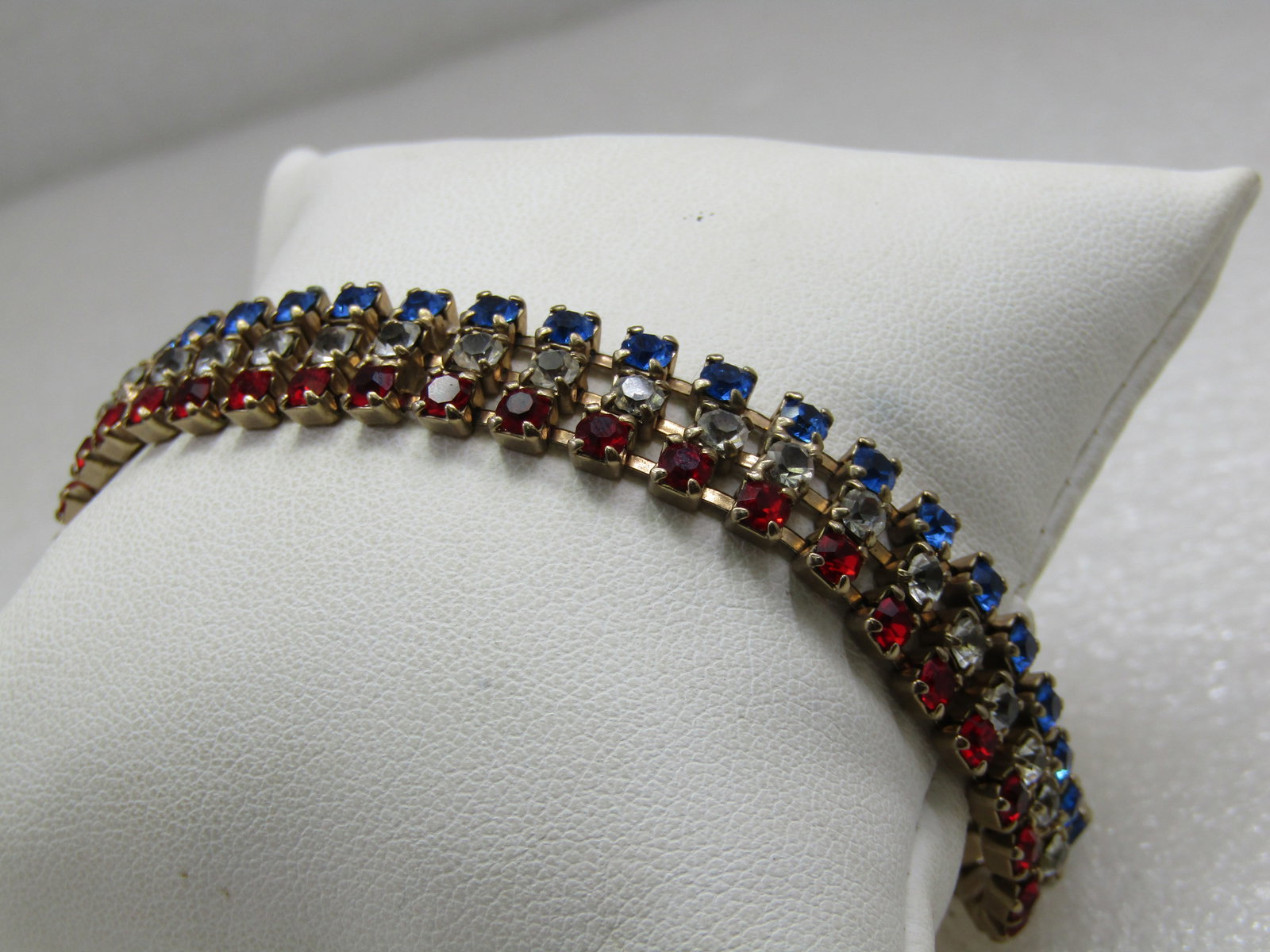 Vintage Red, White, Blue Rhinestone Bracelet, 7": Vintage Red, White, Blue Rhinestone Bracelet, 7" and 1/2" wide. Patriotic and great for holidays or any day. 1960's, flip clasp. There is one red stone that is deeper red than the rest. Good condition