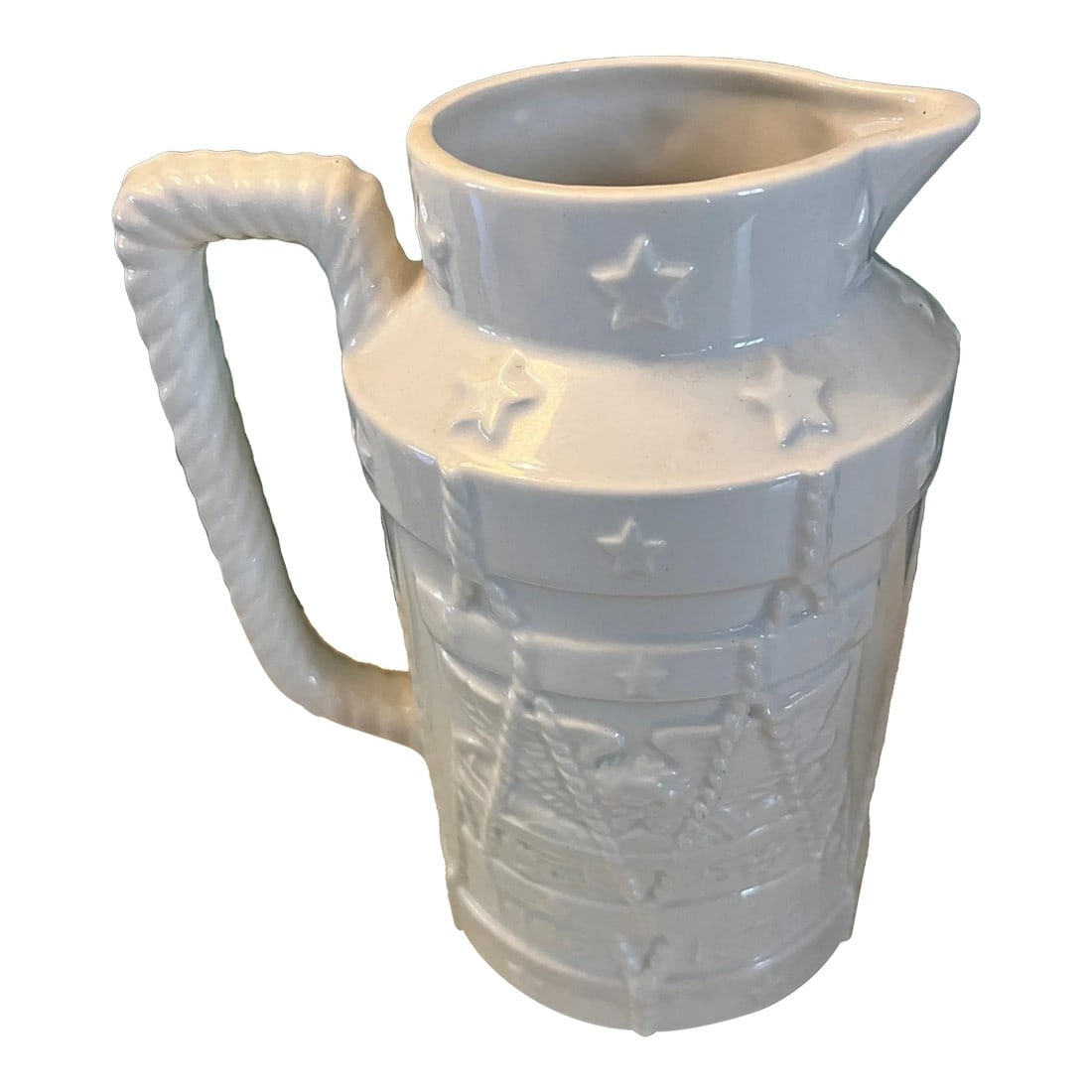 Vintage Bicentennial Pitcher: Great piece of Americana! Price Imports pitcher that was made for Americas Bicentennial. Embossed details include an american eagle, a drum, and stars. All white glaze makes this piece fit in amy type