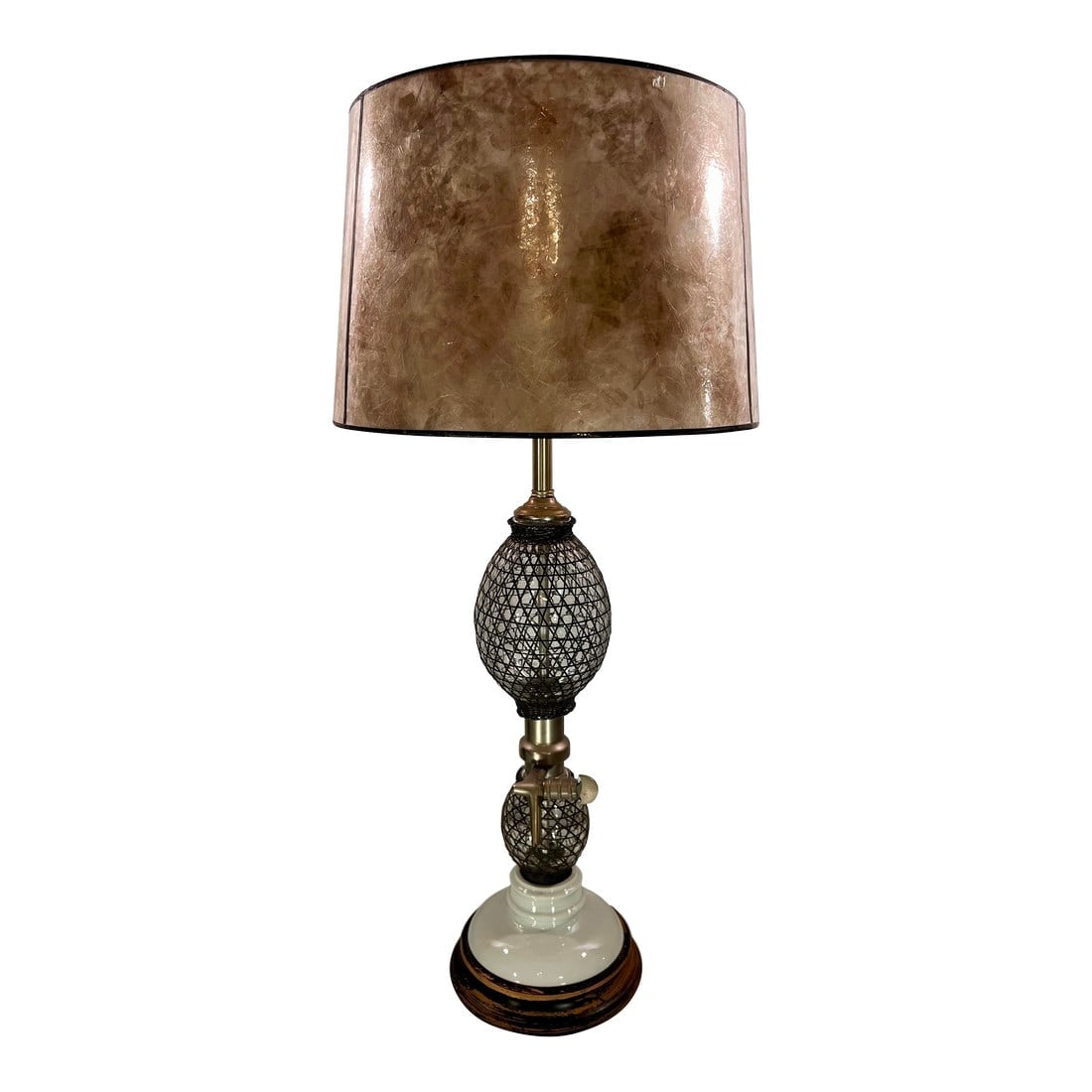 Stylish Vintage Frederick Cooper Seltzer Bottle Table Lamp: This Vintage Frederick Cooper Seltzer Bottle Table Lamp is a truly unique piece that combines industrial aesthetics with vintage charm. The lamp features a porcelain and mesh covered glass body, givin