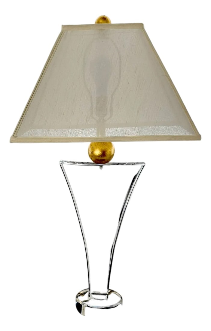 Postmodern Wescal Sculptural Lucite & Gold Leaf Accent Lamp: A sculptural creation, light caught in frozen clarity, this table lamp whispers of post modern design. The Lucite base bends with an elegant geometry, crowned by lustrous spheres in aged gold leaf. It