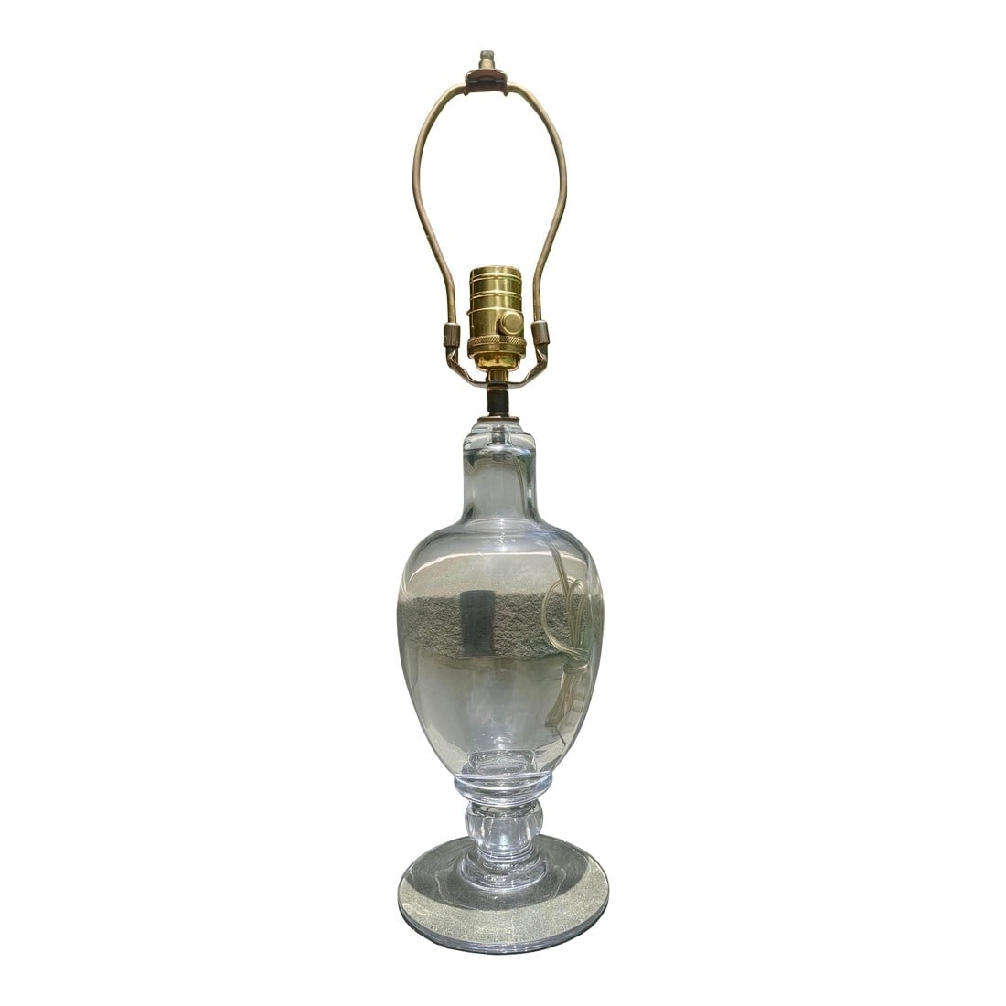 Late 20th Century Hand-Blown Glass Lamp – Attributed to Simon Pearce: An elegant clear glass lamp in the style of Simon Pearce, known for his timeless hand-blown glasswork from Vermont. The lamp features a classic urn-shaped body with a wide circular foot, highlighting