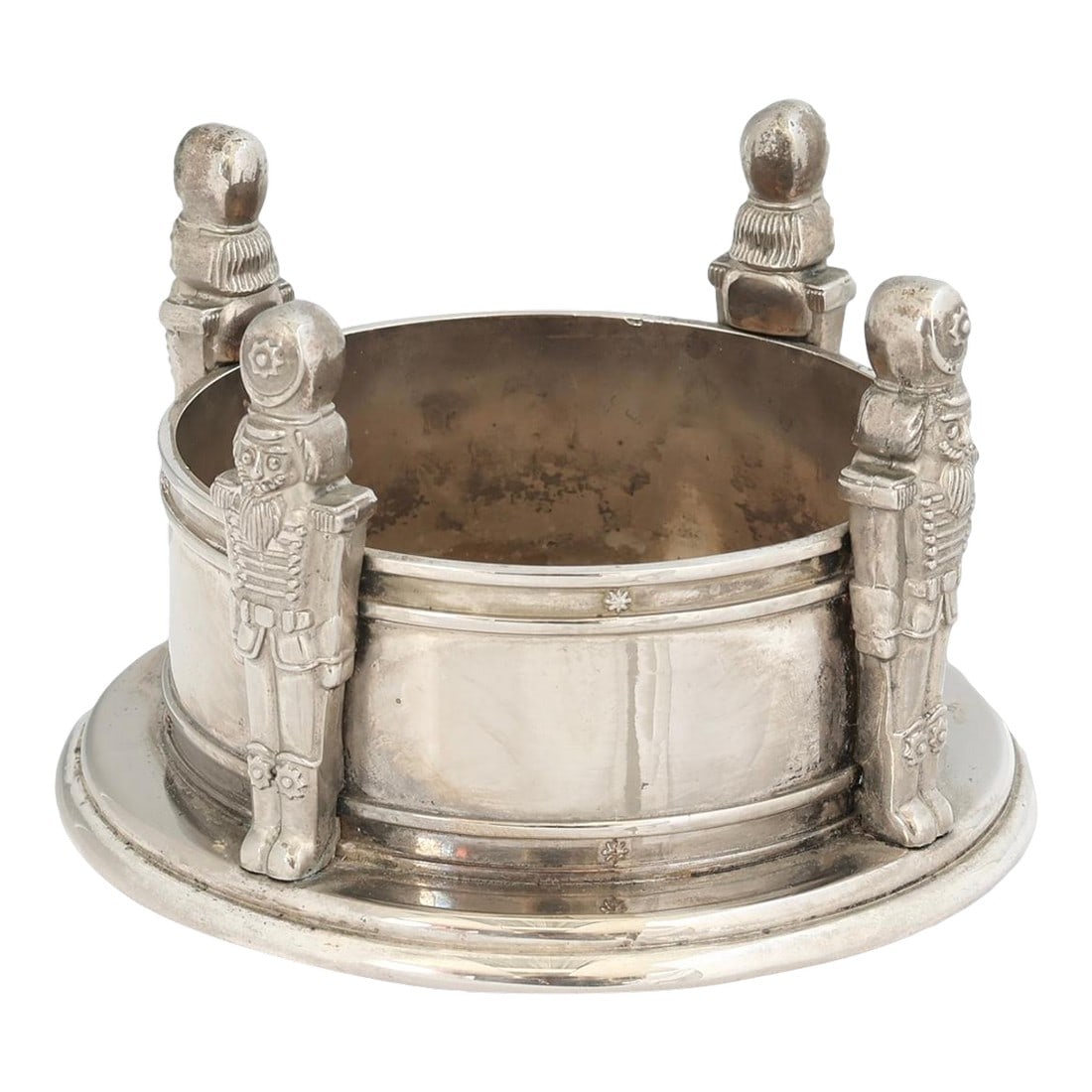 Vintage Godinger Silver-Plate "Nutcracker" Wine Coaster: A festive vintage Godinger silverplate wine coaster encircled by four standing nutcrackers, each finely detailed in full relief with traditional soldier uniforms. Designed to hold and protect surfaces